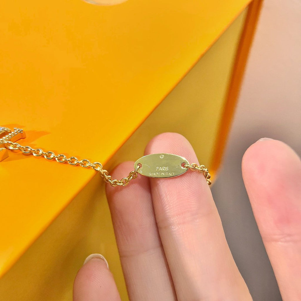 LOUIS VUITTON LOGO STAR MOTIF GOLD BRACELET