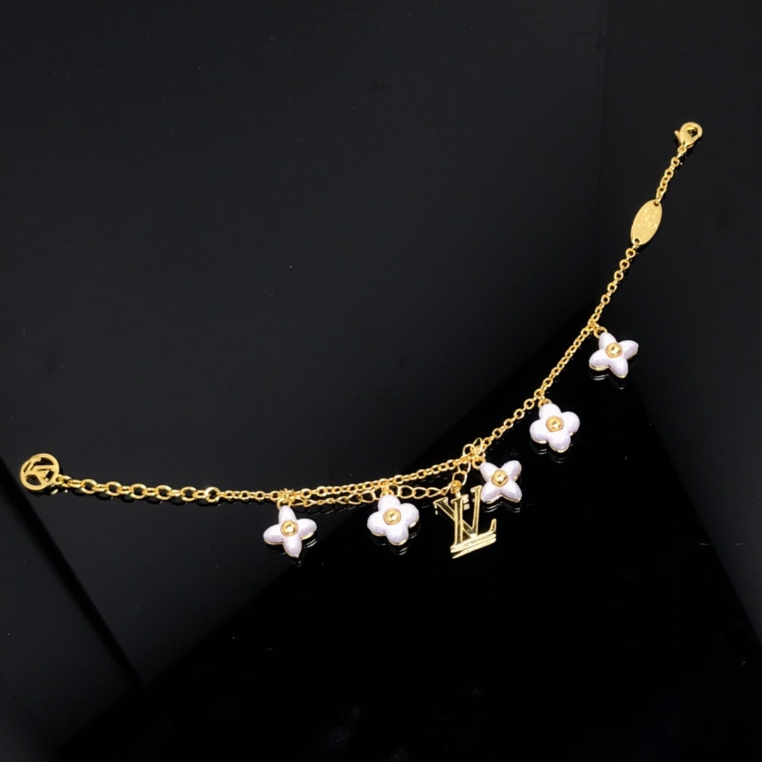 LOUIS VUITTON LOGO 6 MOTIF STAR AND SUN GOLD BRACELET